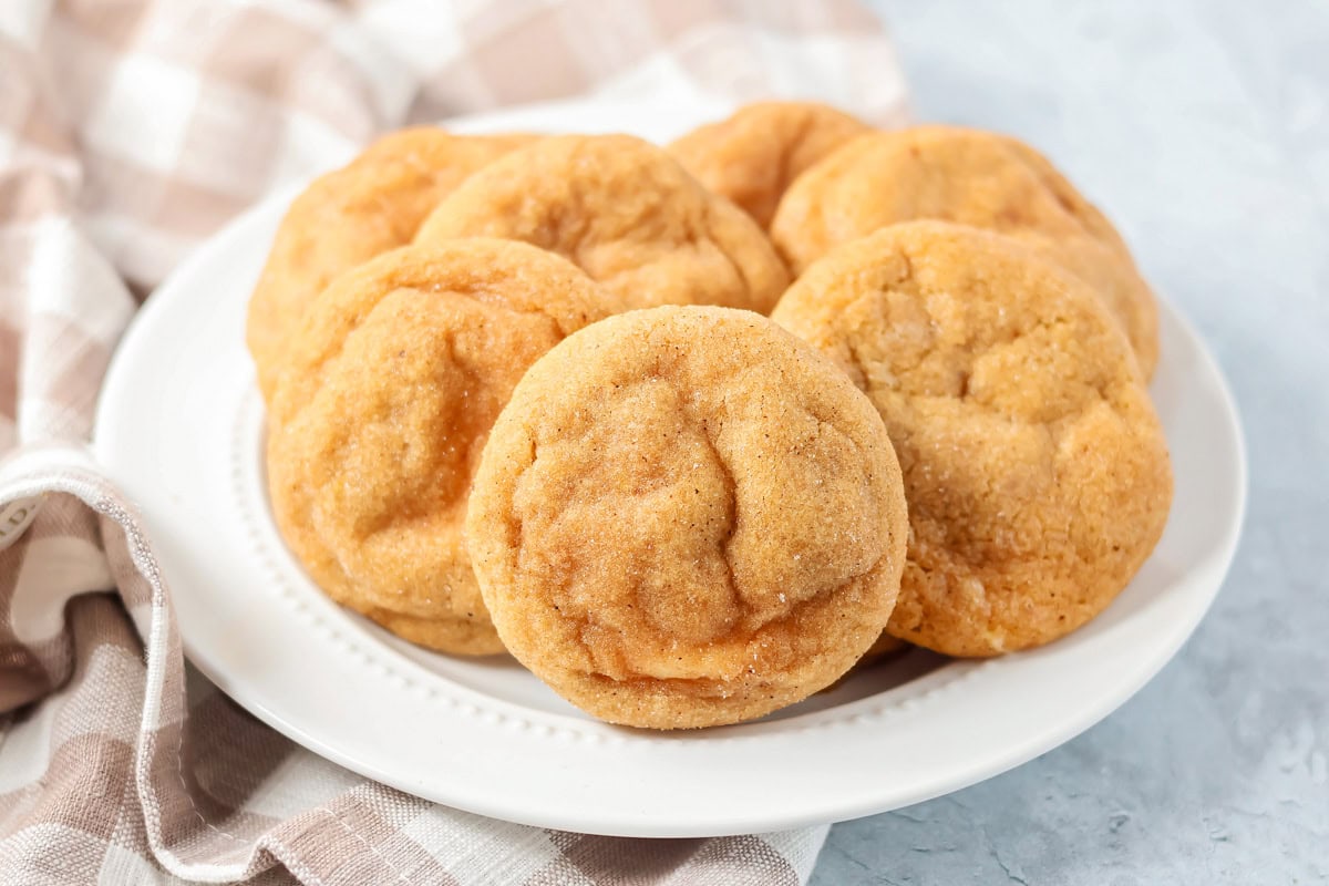A plate filled with pumpkin cheesecake cookies.