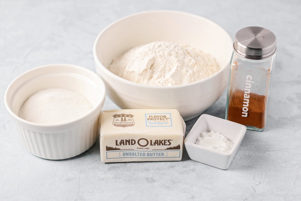 Sour cream apple pie elevates the classic with a rich, tangy, and creamy custard and a buttery crumb topping! Sour cream apple pie crumb topping ingredients on a kitchen counter.