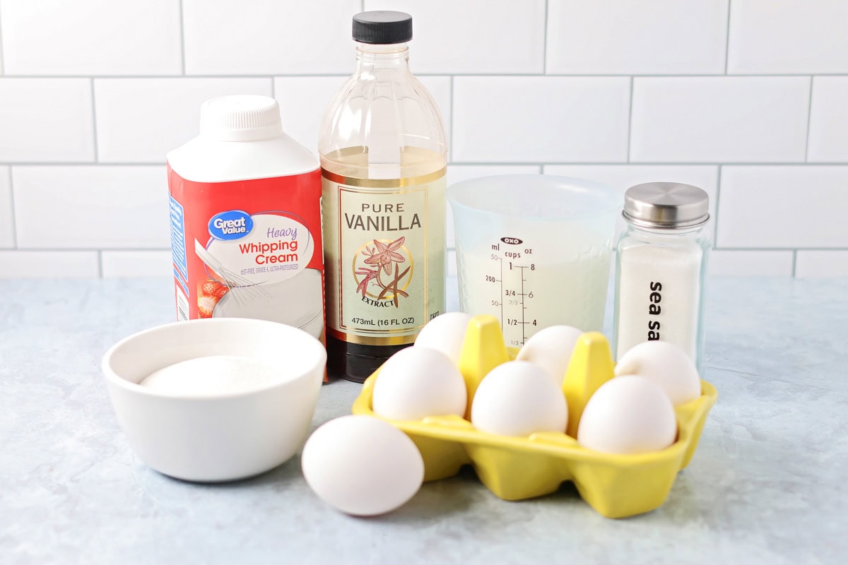 A fancy restaurant-quality crème brûlée is easy to achieve at home!! Just 5 ingredients to create a sugar-crusted creamy vanilla custard! Ingredients to. make creme brulee on a kitchen counter.