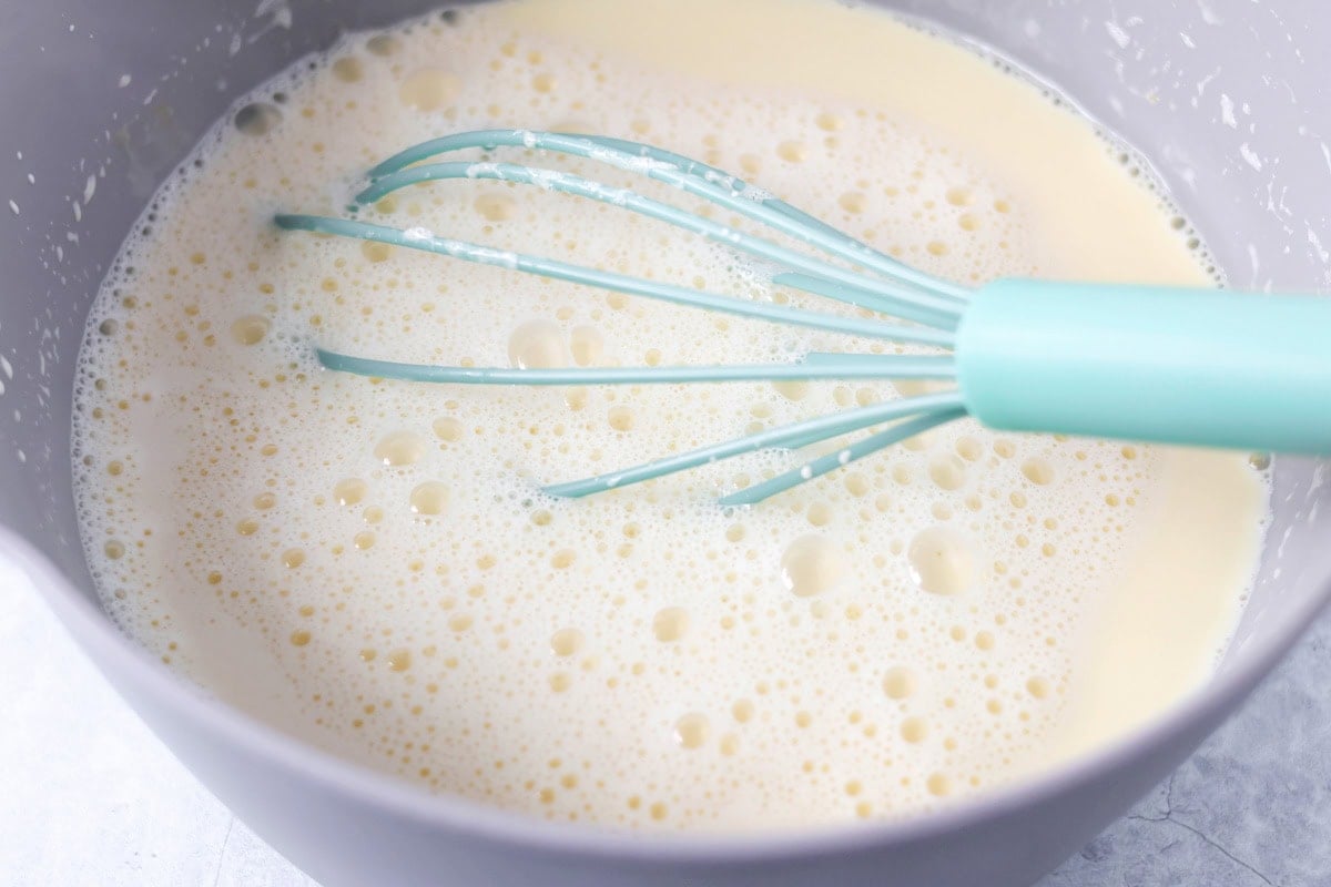 Cream and egg yolk mixture mixed together.