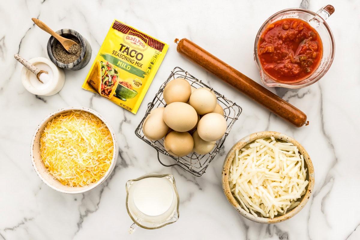 The ingredients to make Mexican breakfast casserole on a kitchen counter. 