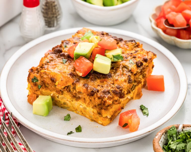 Slice of Mexican Breakfast Casserole served on white plate.