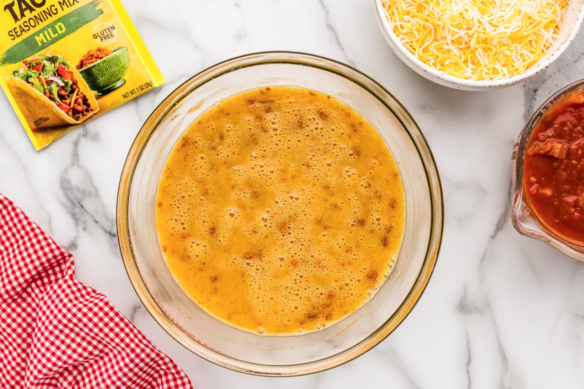 The savory custard ingredients mixed together in a glass bowl. 