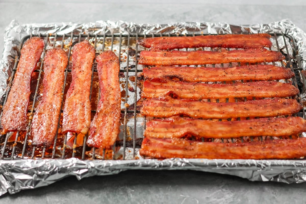 This 3-ingredient candied bacon is the perfect balance of sweet and salty and the ultimate upgrade to any gathering. Crispy baked brown sugar bacon strips on a wire rack.