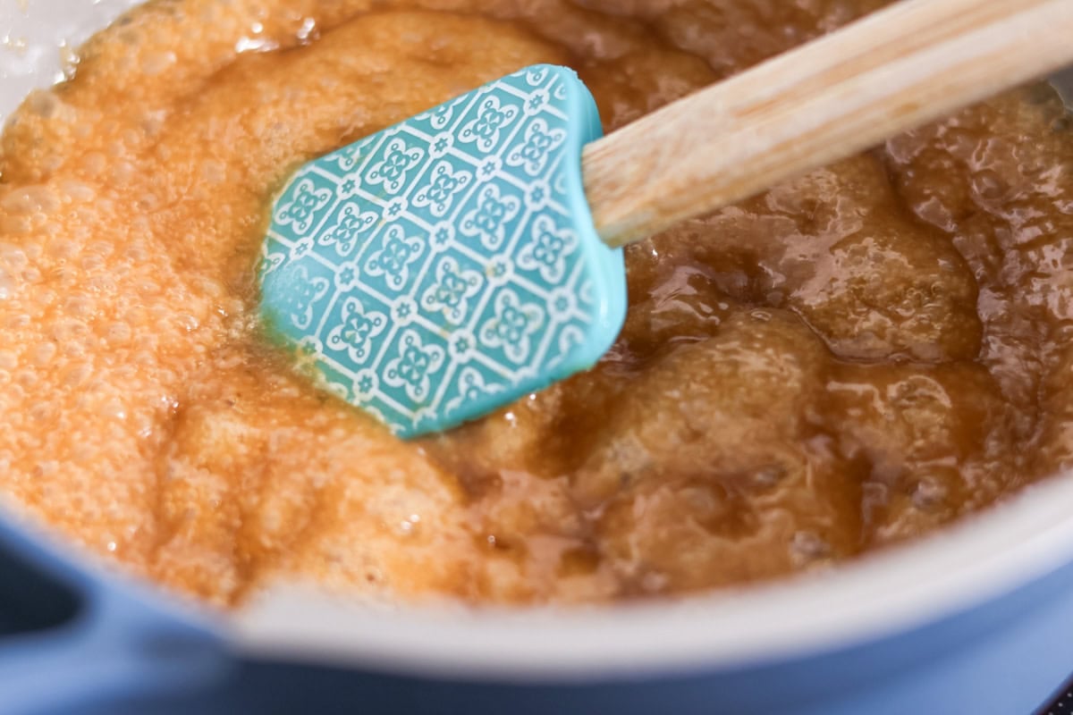Toffee mixture being boiled in a pot.