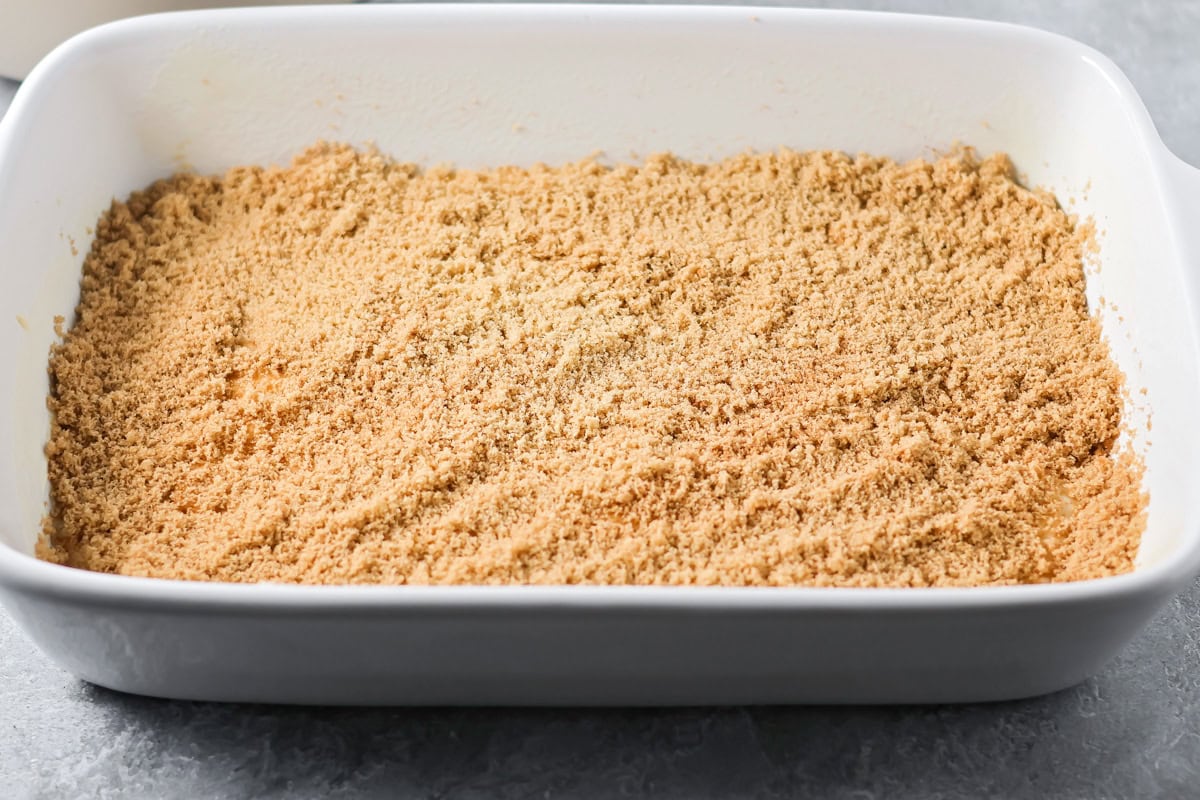 A layer of cinnamon sugar mixture of the poke cake batter.