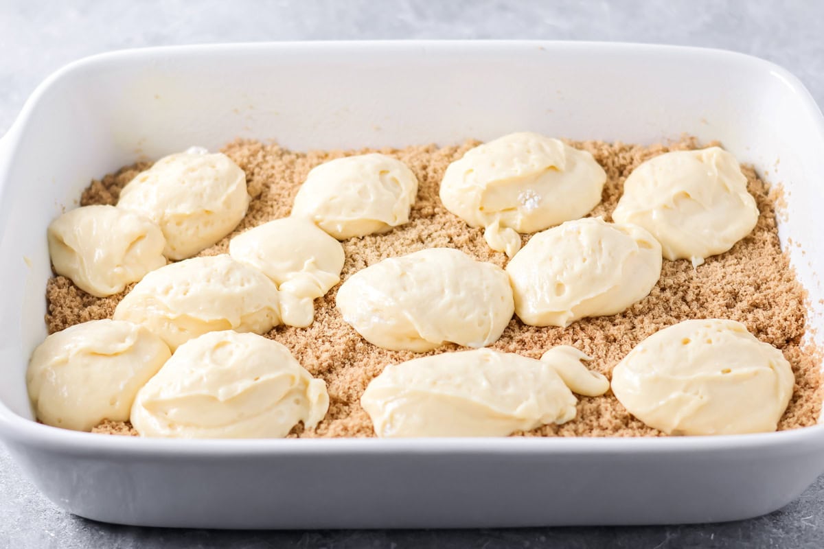 Dollops of batter on top of a cinnamon sugar layer.