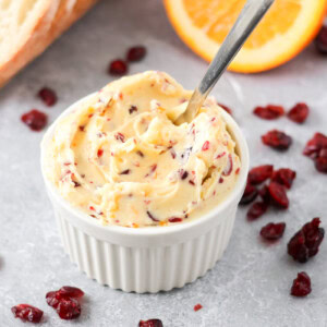 Cranberry honey butter in white rammekin.