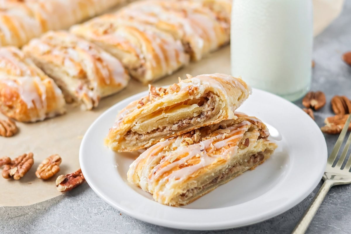 Two slices of Danish krinlges on a white serving plate. 