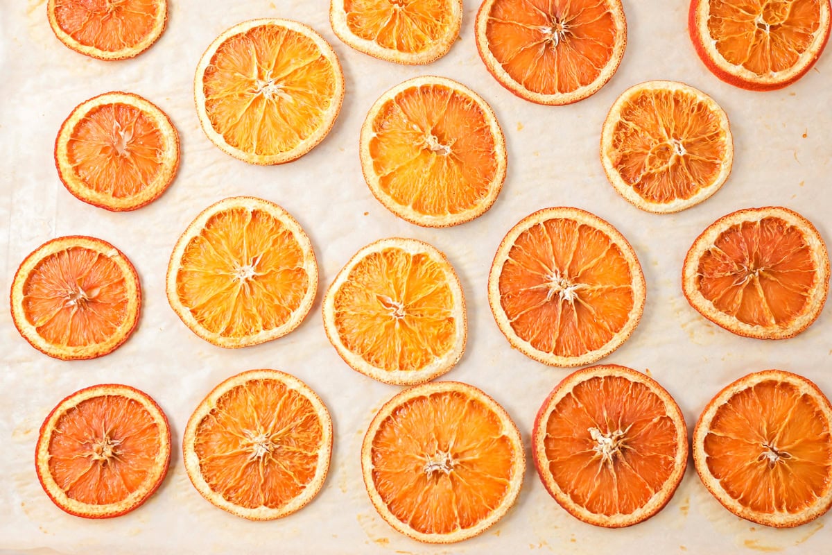 A close up photo of several dried orange slices.