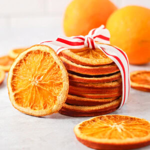 Dried orange slices stacked and wrapped in ribbon.