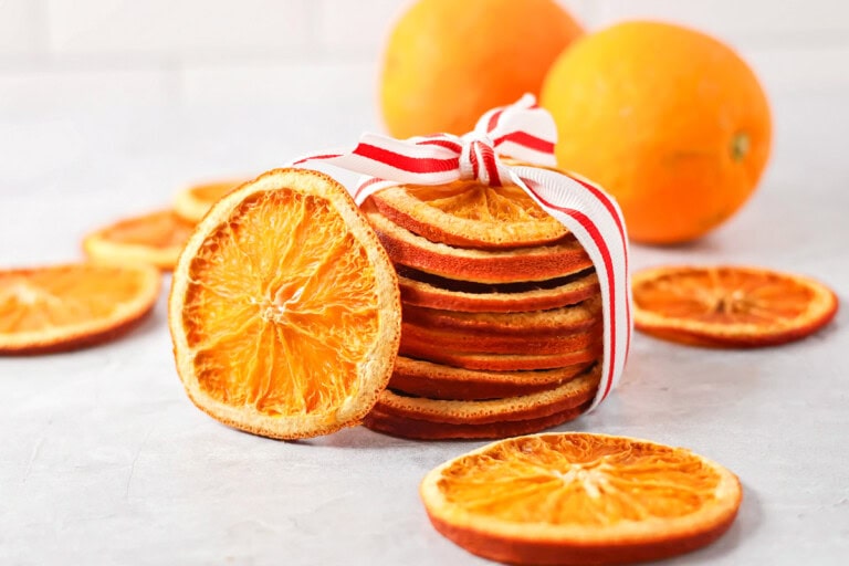 Dried orange slices stacked and wrapped in ribbon.