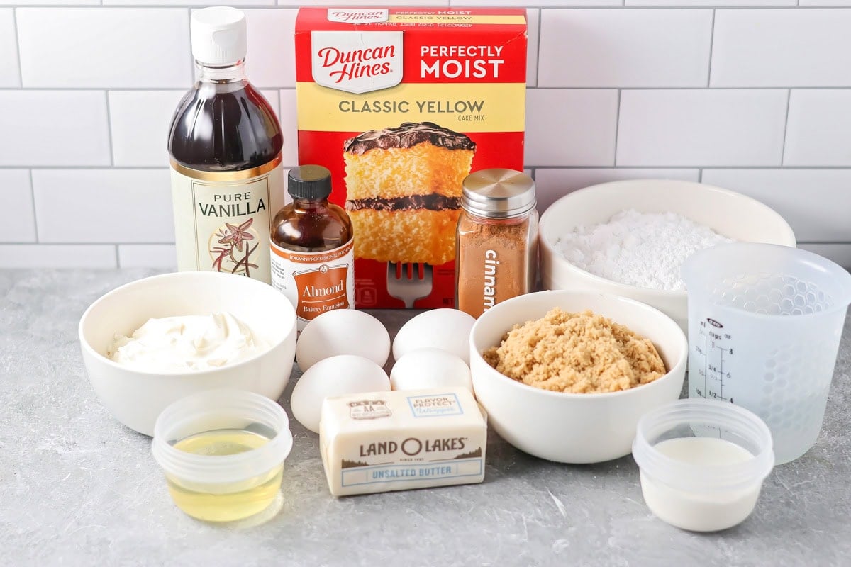 Ingredients to make a honey bun cake on a kitchen counter.