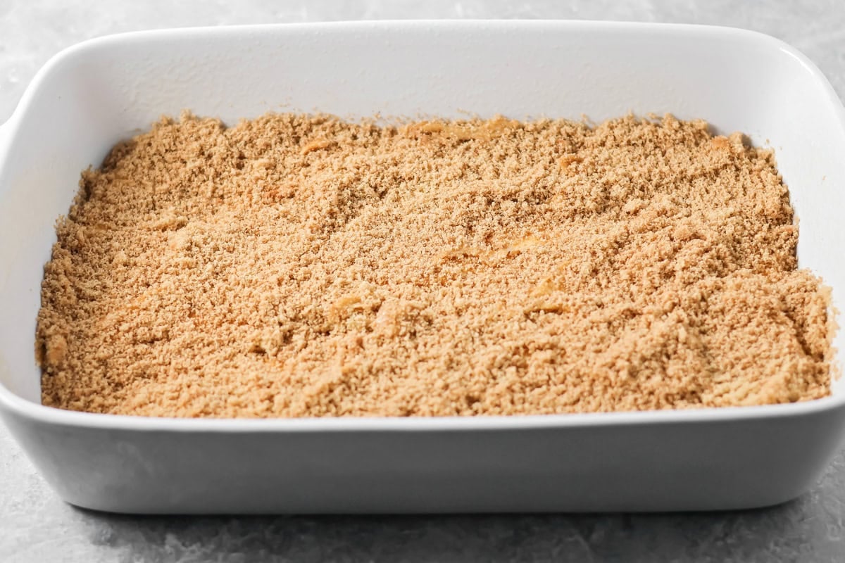 A layer of cinnamon brown sugar over the batter in a baking dish.