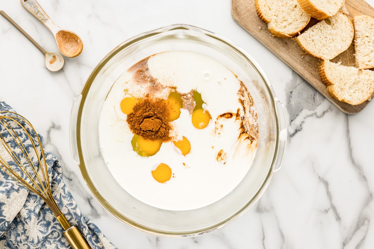 Unmixed French toast egg custard in a mixing bowl.