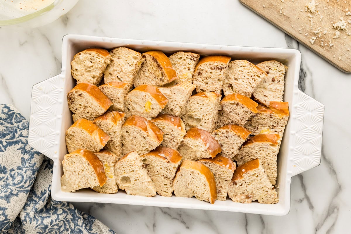 Custard dipped slices of French toast in a baking dish.