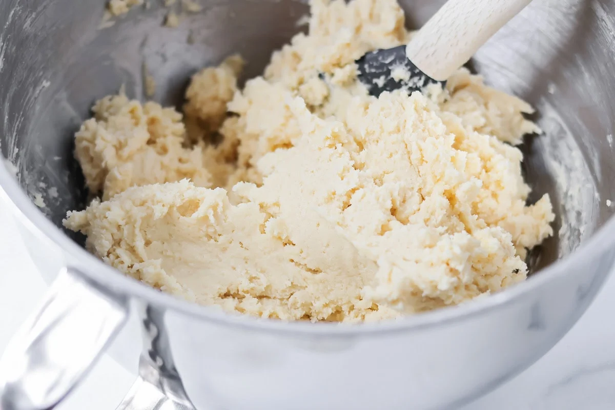 Sugar cookie dough in a mixing bowl.