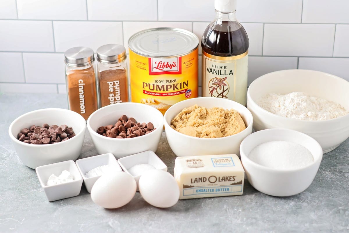 Ingredients to make pumpkin chocolate chip bars on a kitchen counter.