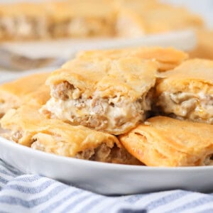 Sausage cream cheese casserole recipe cut and stacked on each other on plate.