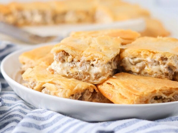 Sausage cream cheese casserole recipe cut and stacked on each other on plate.