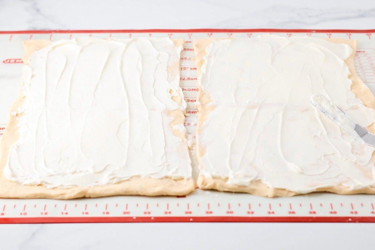 Filled with sausage crumbles and cream cheese, these sausage pinwheels are the ultimate savory snack or party appetizer! Two sheets of crescent roll dough spread with a thin layer of cream cheese.