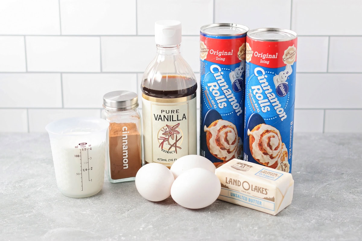 Warm, gooey, and easy to make, this cinnamon roll casserole turns refrigerated rolls into a cozy breakfast everyone will love. Ingredients to make a cinnamon roll casserole on a kitchen counter.