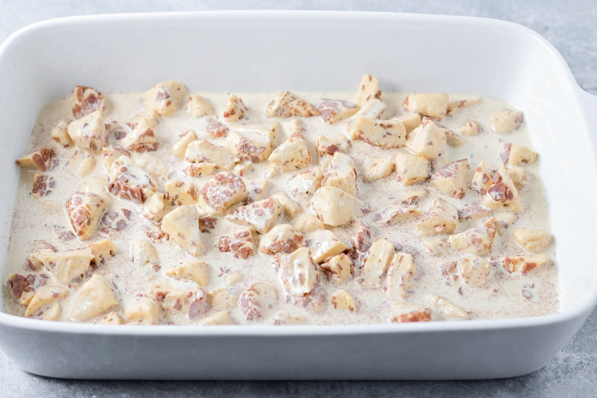 Warm, gooey, and easy to make, this cinnamon roll casserole turns refrigerated rolls into a cozy breakfast everyone will love. Unbaked cinnamon roll casserole in a baking dish.