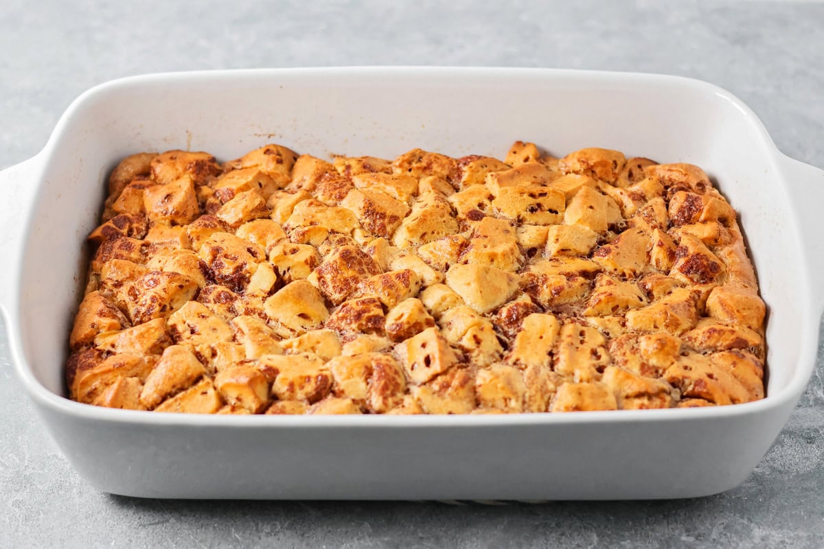 Warm, gooey, and easy to make, this cinnamon roll casserole turns refrigerated rolls into a cozy breakfast everyone will love. Baked cinnamon roll casserole on the counter.
