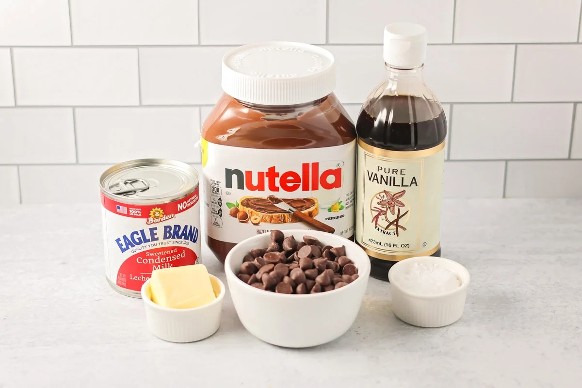 Ingredients for Nutella fudge on a kitchen counter.
