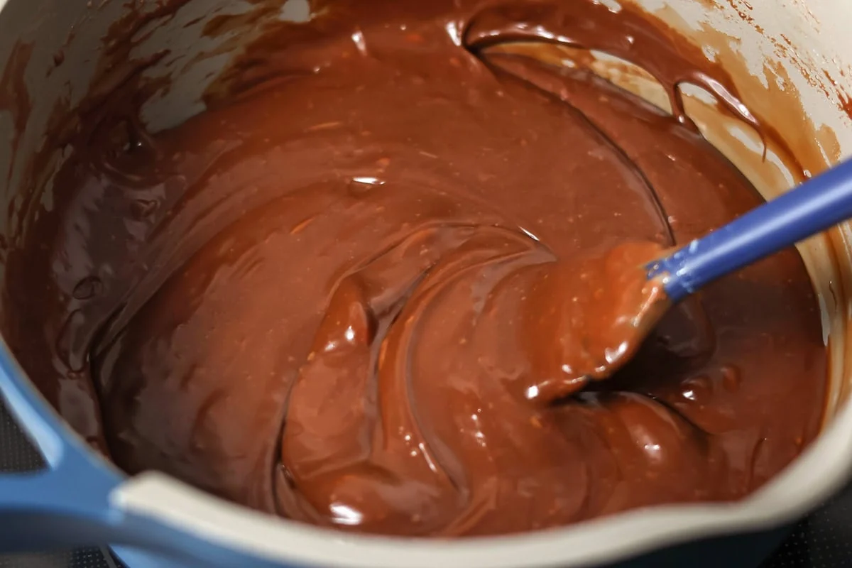 Melted fudge batter in a saucepan.