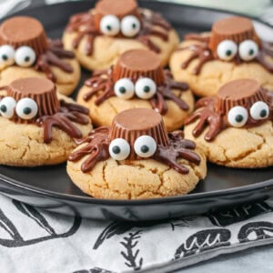 Peanut Butter Spider Cookies on black plate.