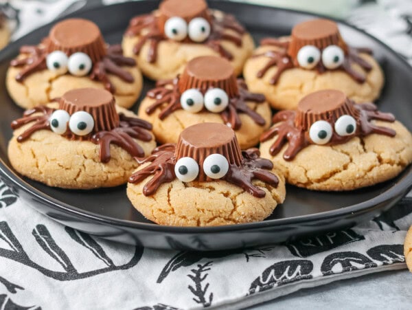 Peanut Butter Spider Cookies on black plate.