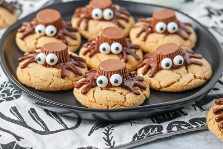 Peanut Butter Spider Cookies on black plate.