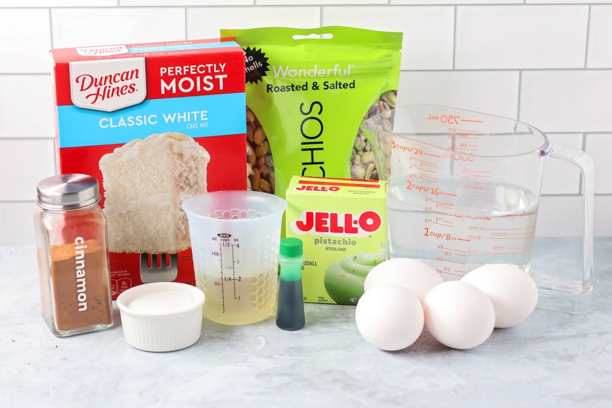 Ingredeints to make pistachio cake o a kitchen counter.