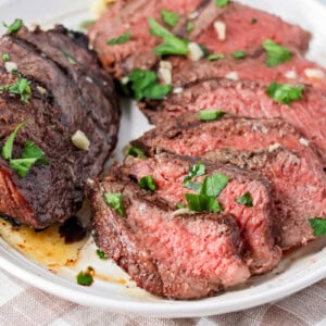 Sliced up sirloin steak served on a plate.