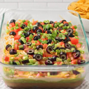 Easy 7 layer bean dip in a glass 9x13 dish.