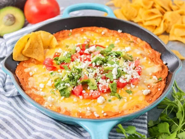 Best bean dip recipe served in skillet with tortilla chips.