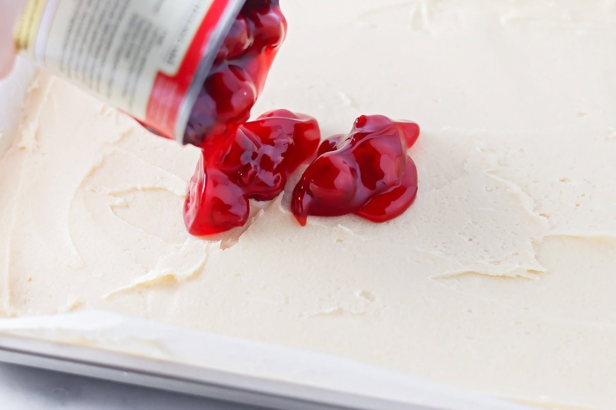 Cherry filling poured over base.