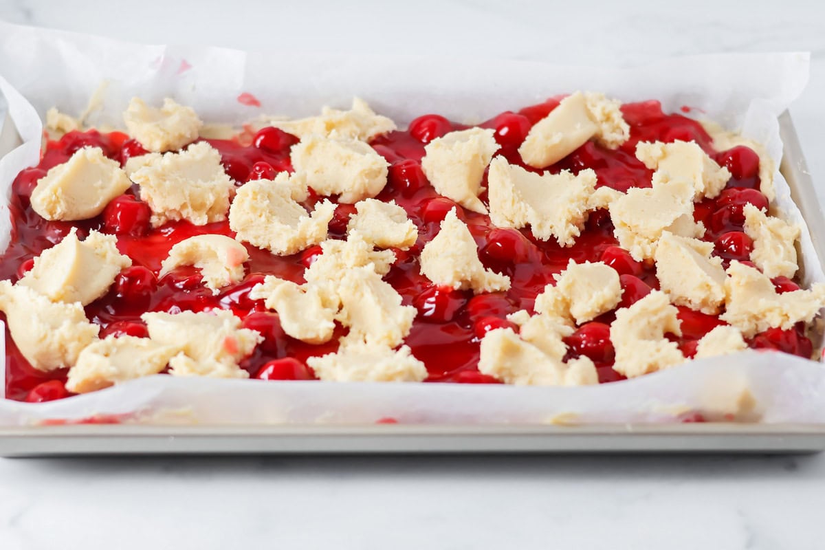 Process picture of how to make cherry bars.