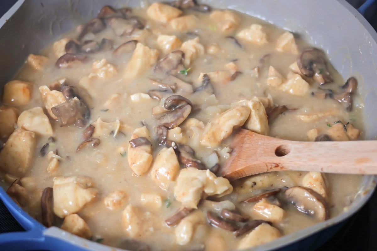 Creamy chicken stroganoff is perfect for dinner any night of the week. It's full of flavor and is made, start to finish, in about 30 minutes! Adding chicken to the creamy mushroom roux.