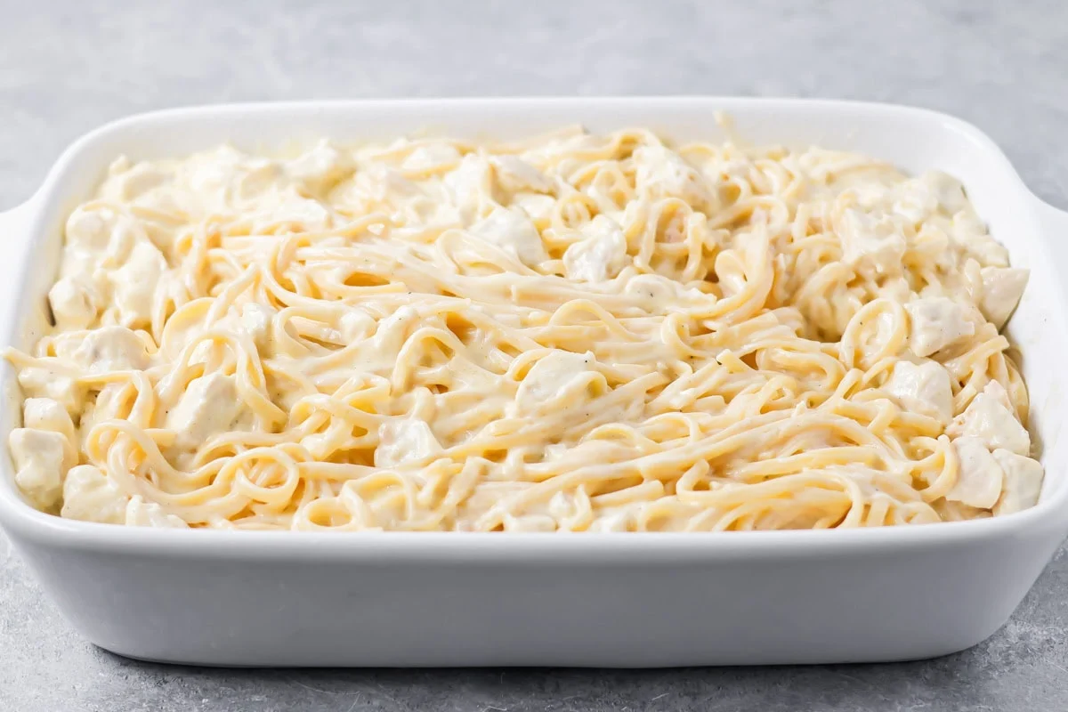 Unbaked chicken tetrazzini in a baking dish.
