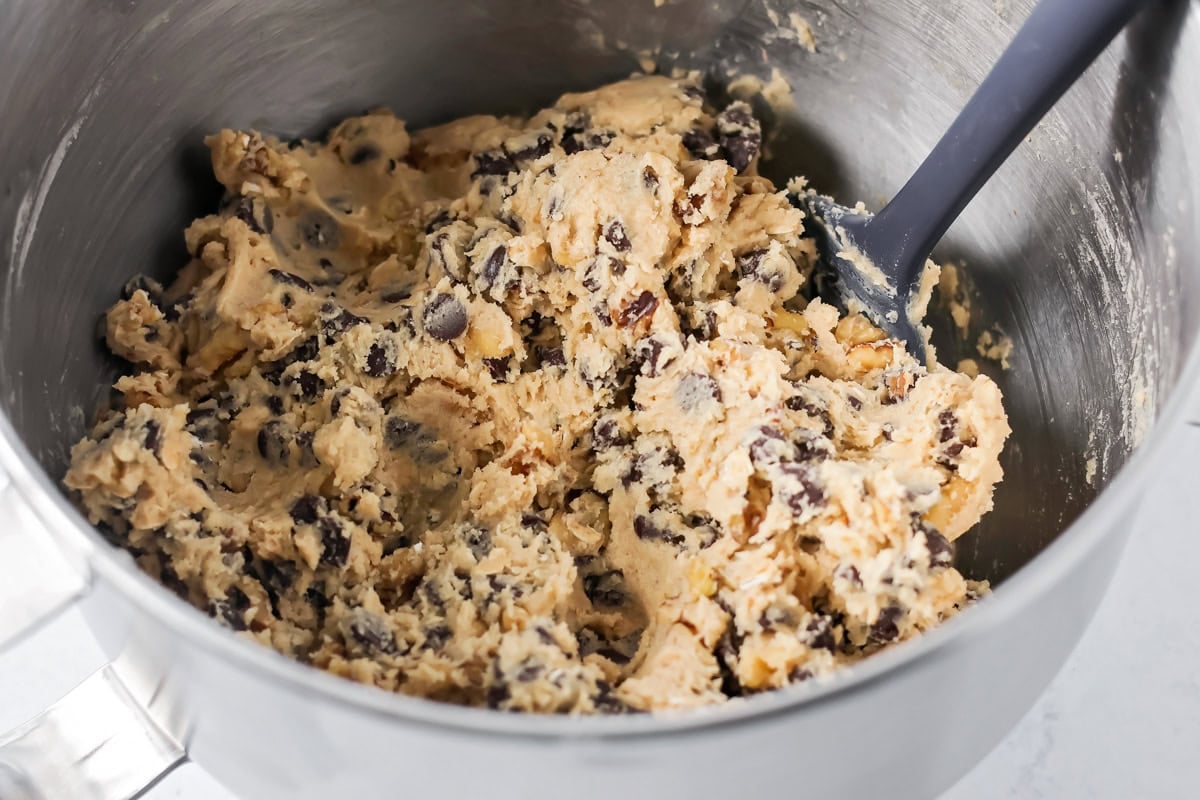 Copycat Doubletree cookies are big, chewy, and baked soft in the center with crisp edges for the ultimate treat. Fully mixed cookie dough in a mixing bowl.