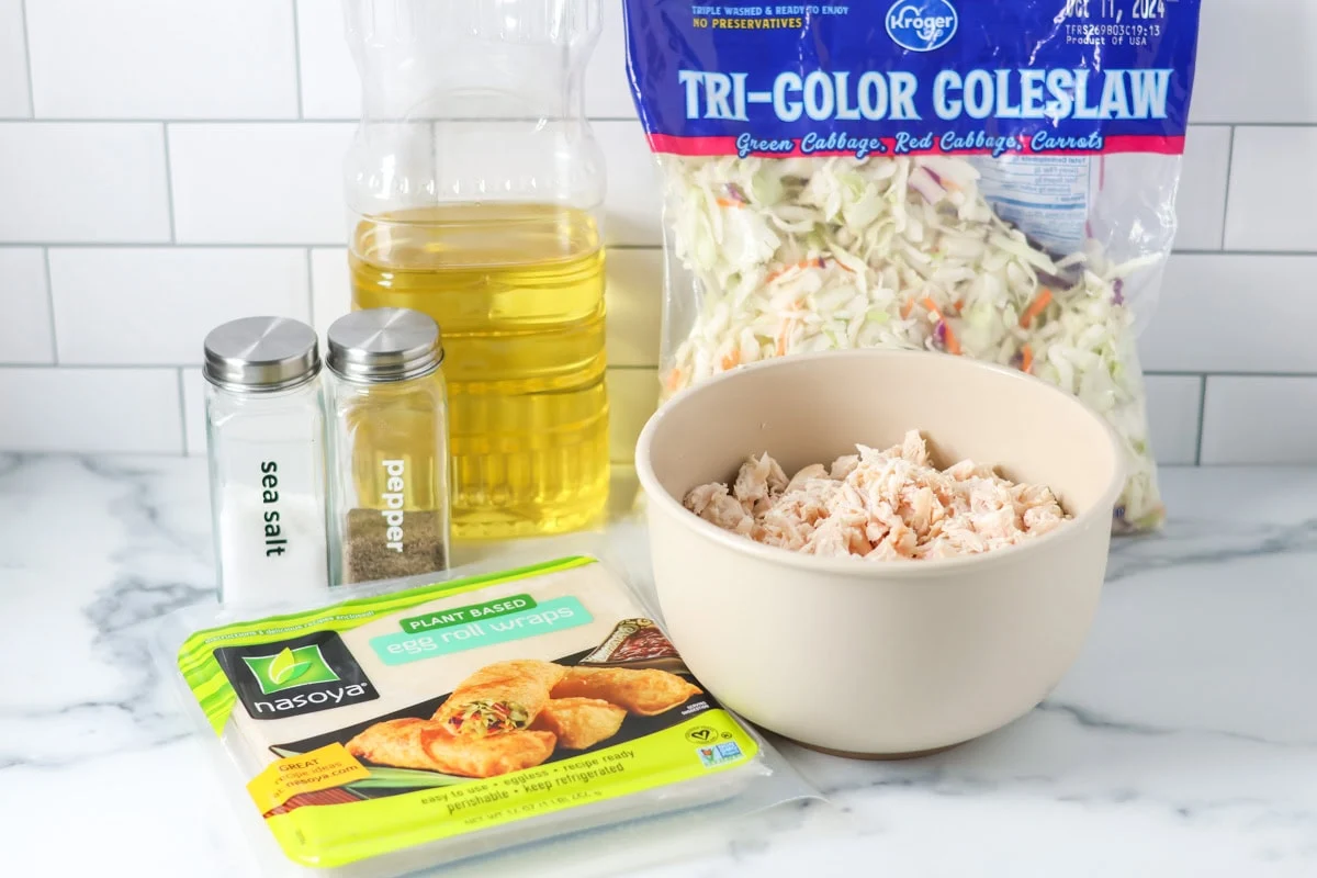 Ingredients for homemade egg roll recipe on a white countertop.