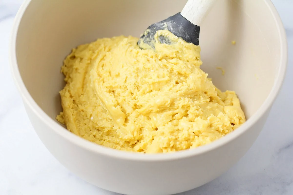 Thick cake batter in a mixing bowl.