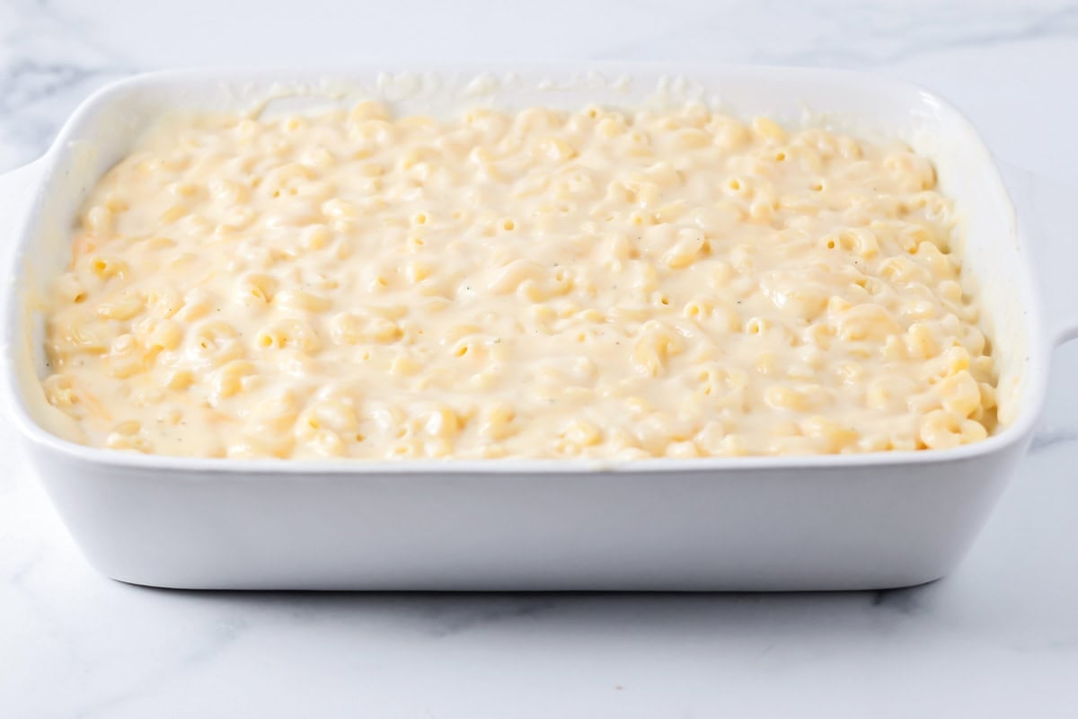Mac and cheese recipe poured into casserole dish.