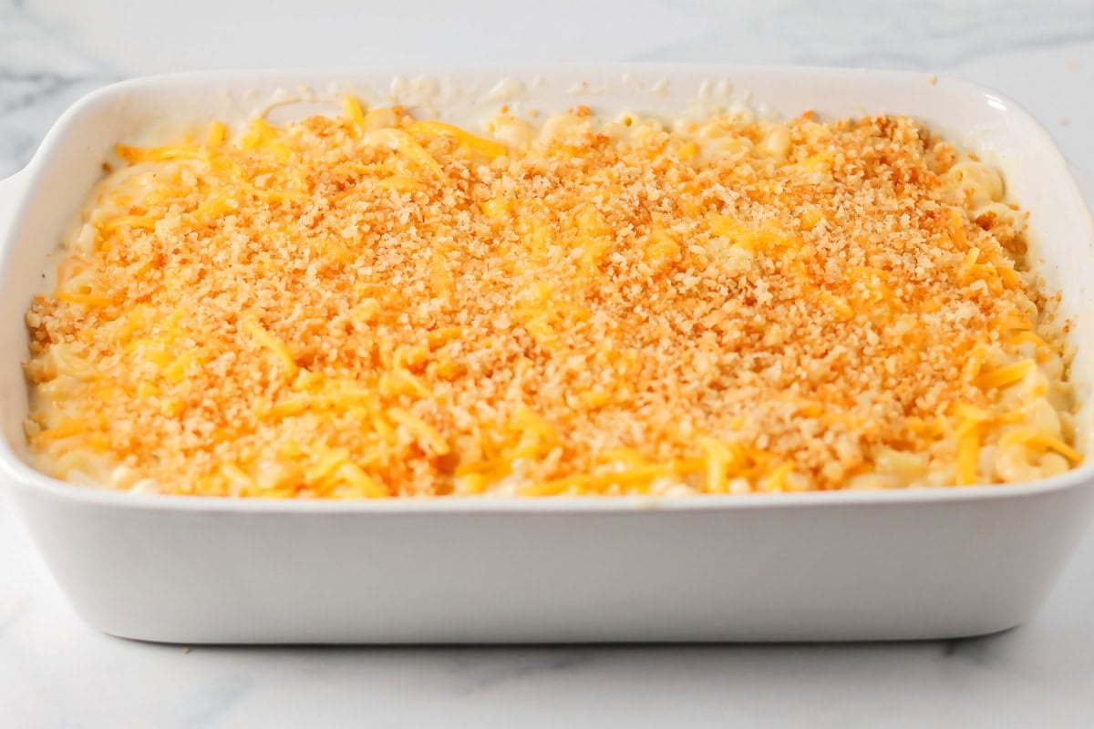 Homemade mac and cheese recipe poured into casserole dish.