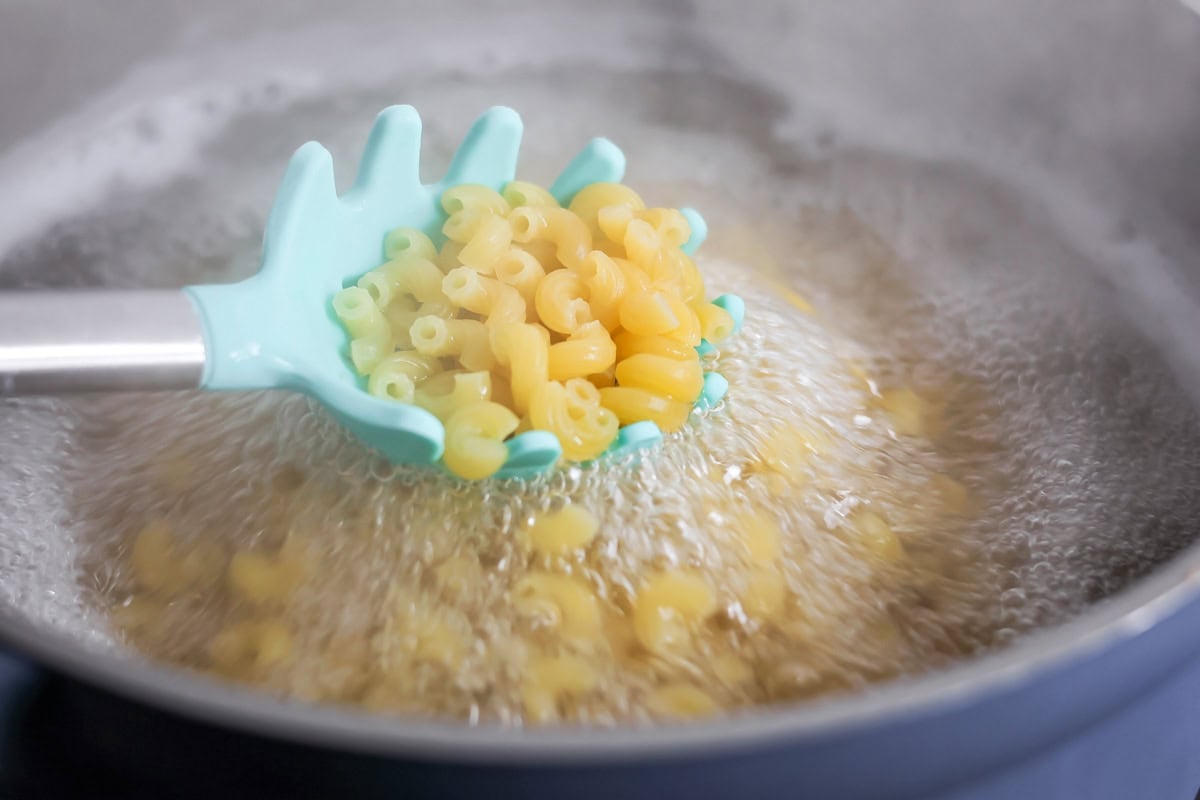 Elbow macaroni being cooked.