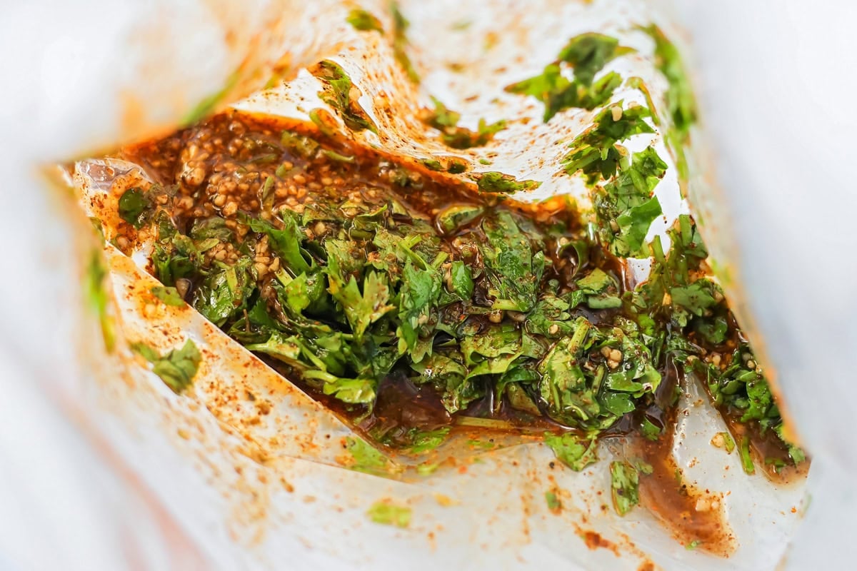 Mexican chicken marinade ingredients in Ziploc bag.