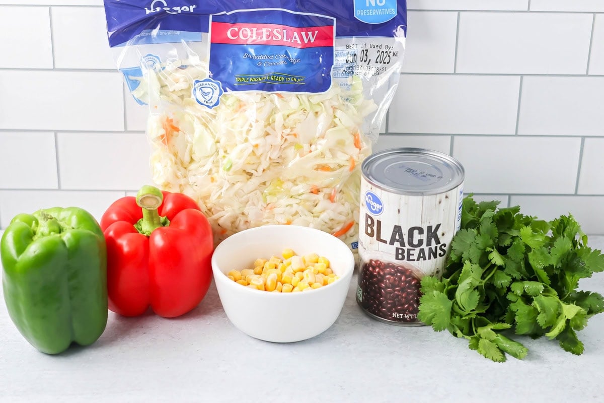 Ingredients for Mexican coleslaw on counter.