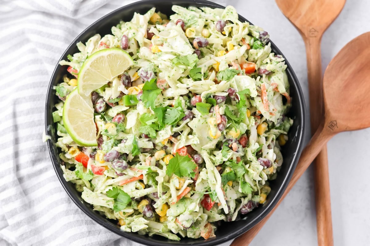 Close up image of Mexican Colelsaw in black bowl.